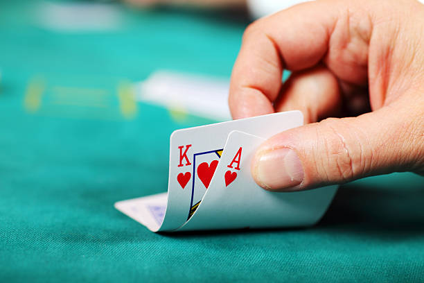 Live dealer spinning a French Roulette wheel